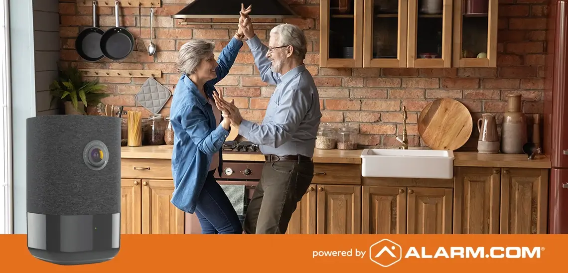 Elderly couple dancing in the kitchen