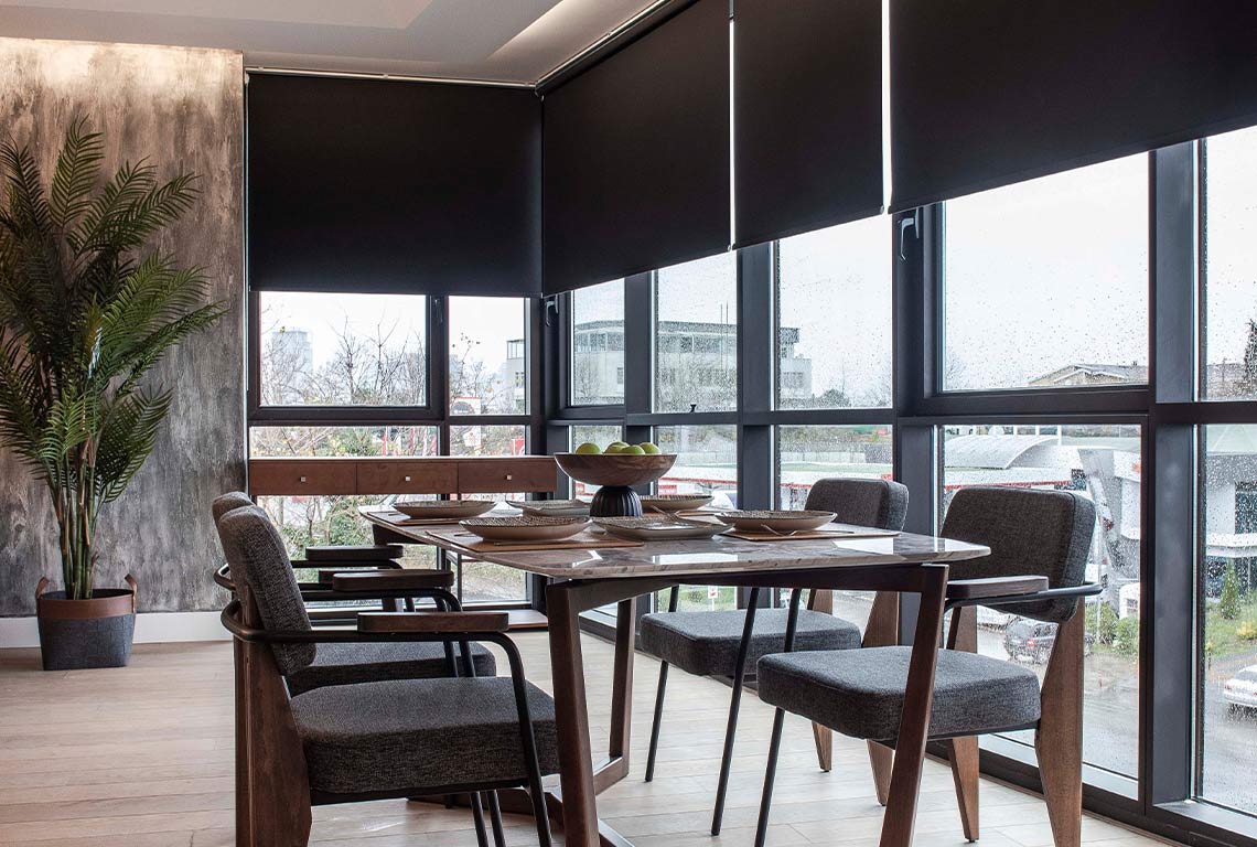 Modern dining room with large windows and blinds