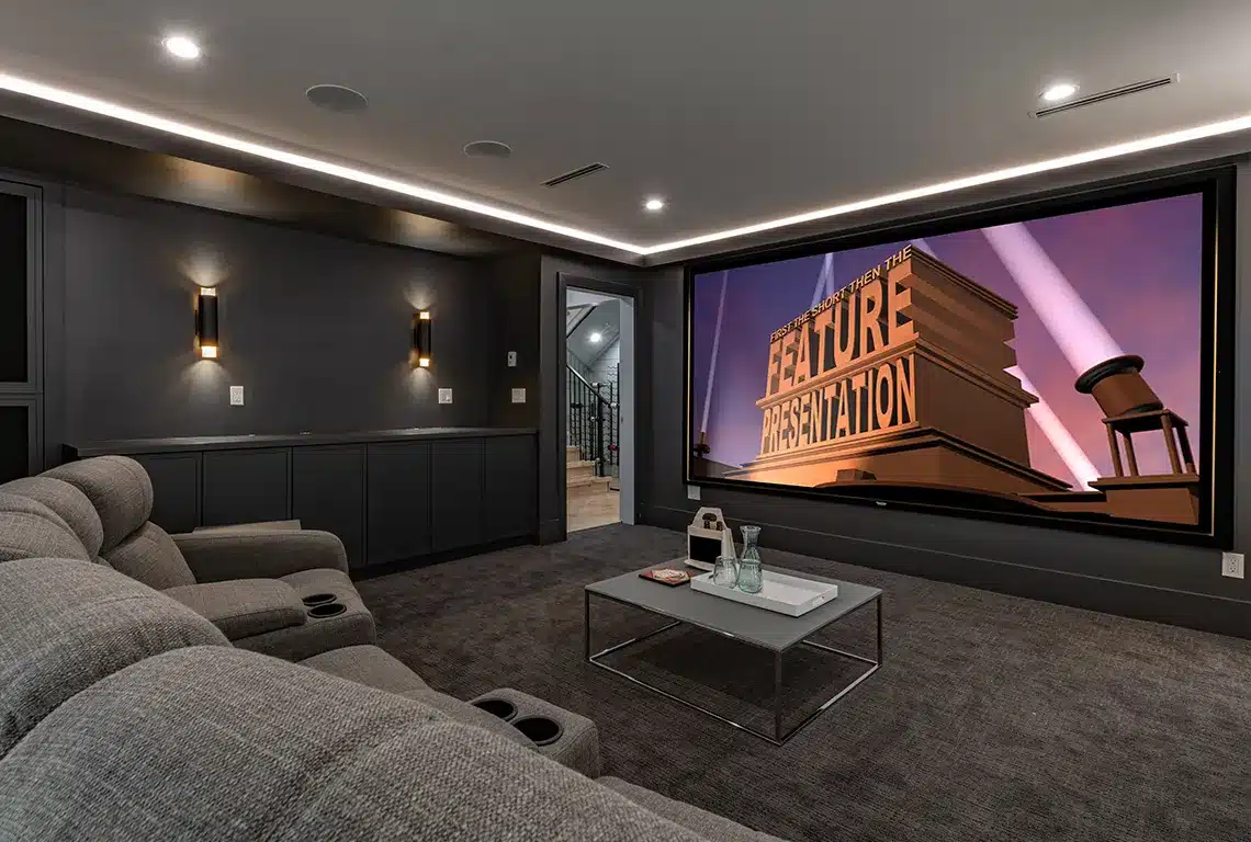 Modern home theater with large screen and recliners