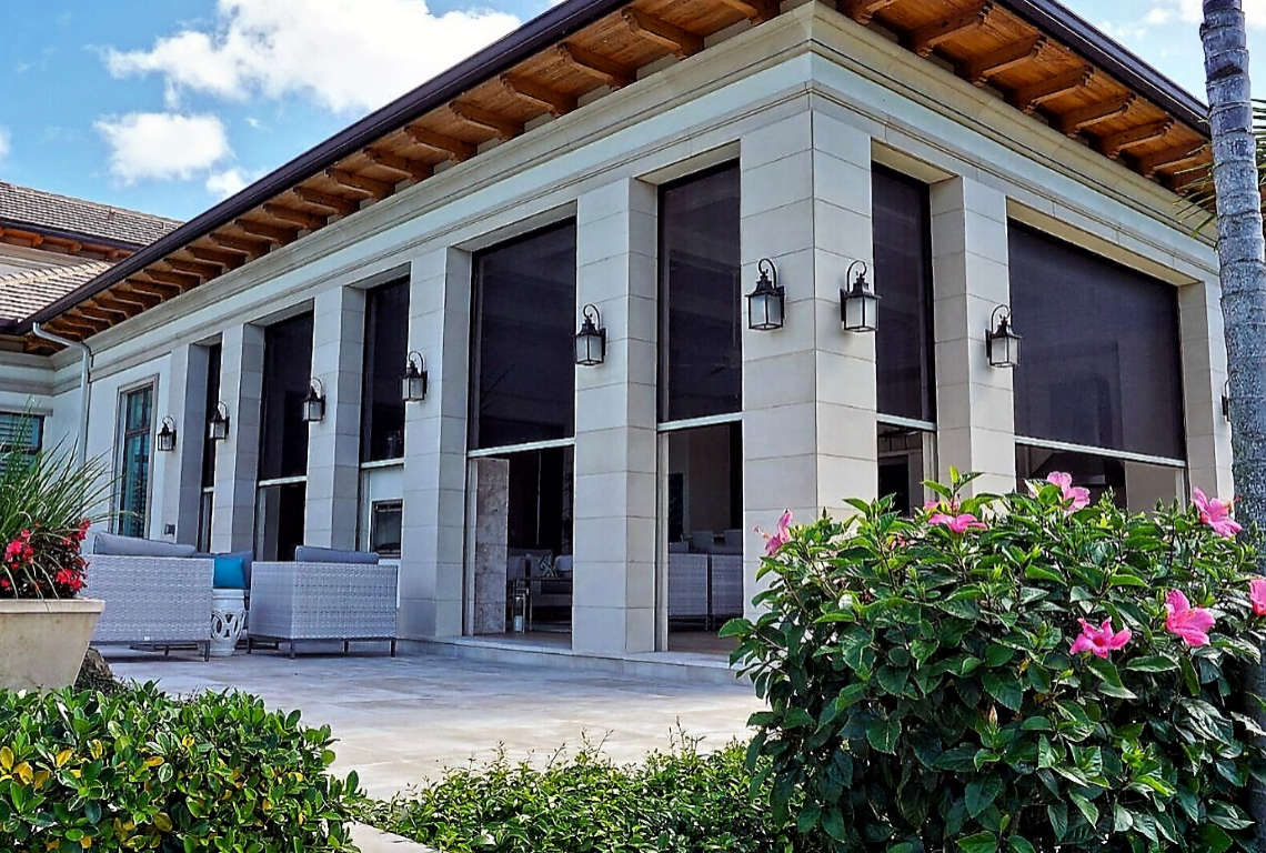 Modern patio with large windows and flowers