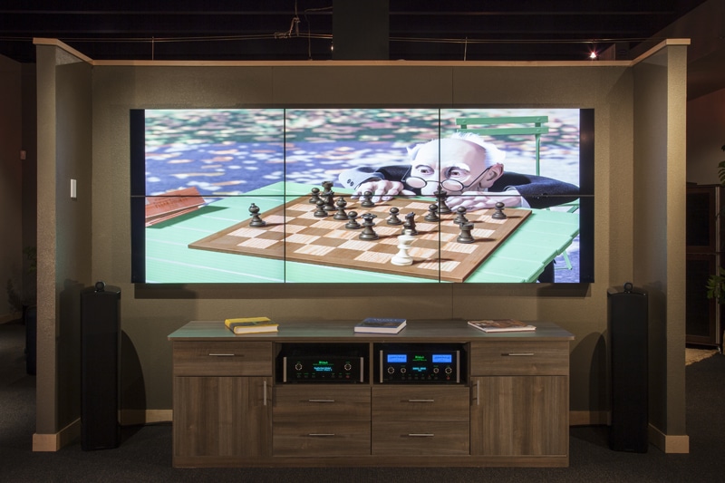 Large TV showing animated chess scene in living room