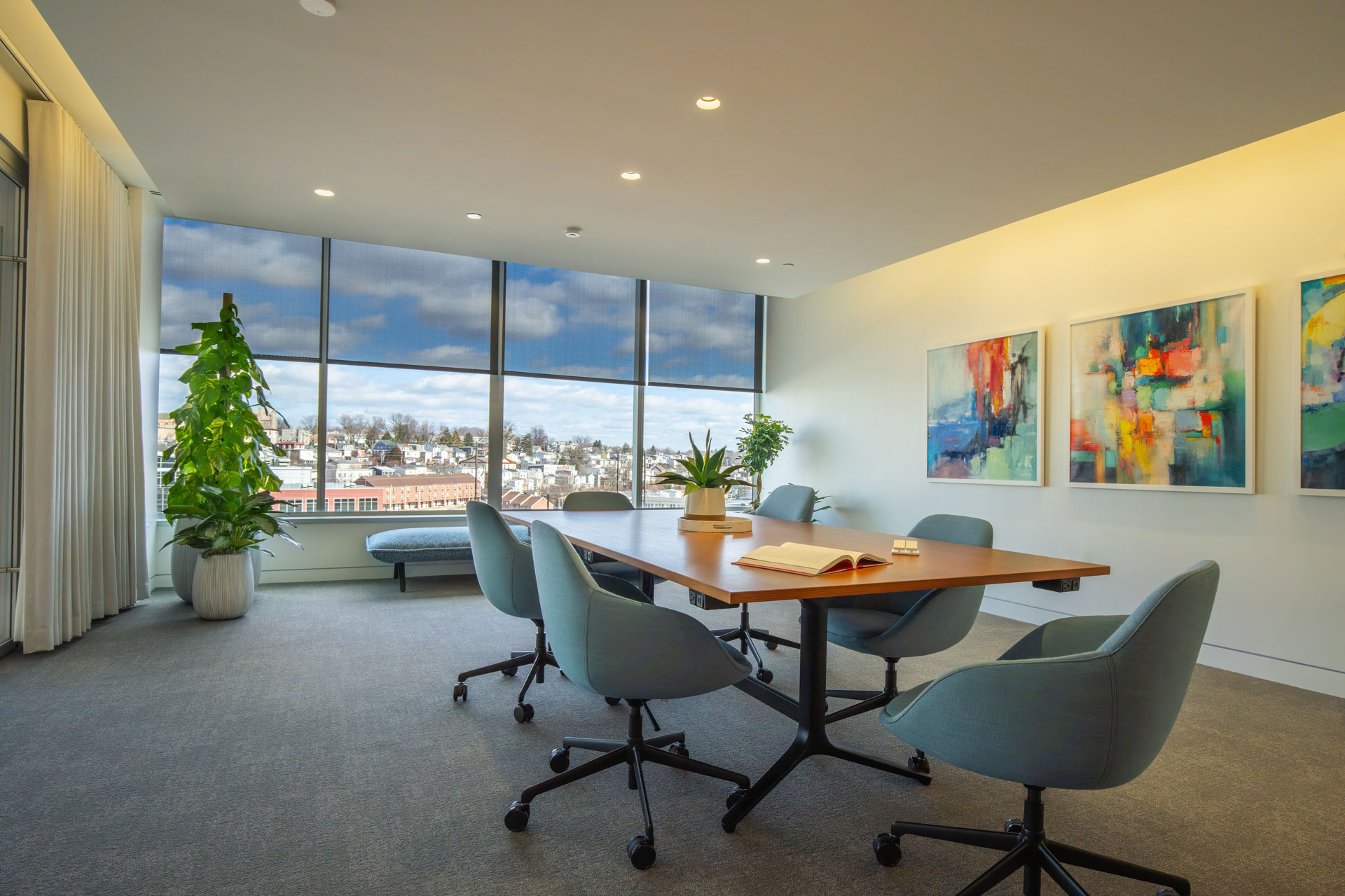 Modern conference room with city view and artwork